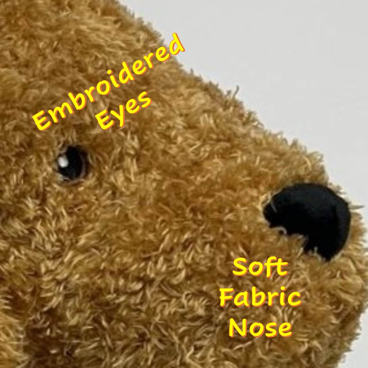 Golden Doodle dog breed shaped plush dog toy showing embroidered eyes and felt nose