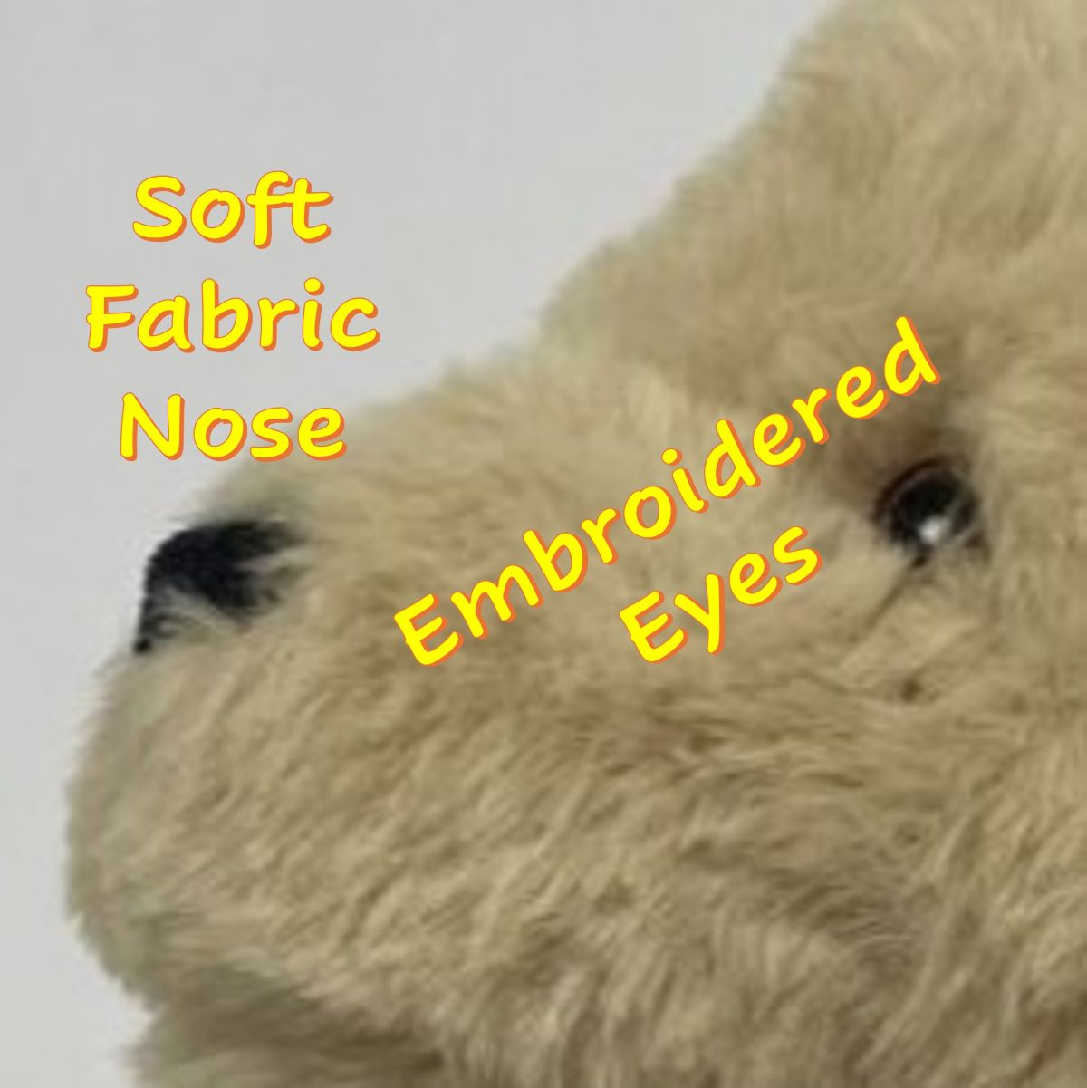 Close-up of a beige plush Tan Spaniel / Labrodor dog toy face with embroidered eyes and Soft Fabric Nose